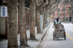 Shanghai, China, 28th Jan 2020, Sanitation worker cleaning the empty streets in Shanghai China amidst the Coronavirus outbreak, Edwin Remsberg