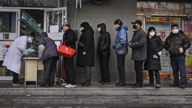BEIJING, CHINA - FEBRUARY 02: Chinese residents line up to get a free protective mask at a local pharmacy on February 2, 2020 in Beijing, China. The number of cases of a deadly new coronavirus rose to more than 17000 in mainland China on Monday, days after the World Health Organization (WHO) declared the outbreak a global public health emergency. China continued to lock down the city of Wuhan in an effort to contain the spread of the pneumonia-like disease which medicals experts have confirmed can be passed from human to human. In an unprecedented move, Chinese authorities have put travel restrictions on the city which is the epicentre of the virus and neighbouring municipalities affecting tens of millions of people. The number of those who have died from the virus in China climbed to at least 360 on Monday, mostly in Hubei province, with the first known death outside of China reported in the Philippines. Cases have been reported in other countries including the United States, Canada, Australia, Japan, South Korea, India, the United Kingdom, Germany, France and several others. The World Health Organization has warned all governments to be on alert and screening has been stepped up at airports around the world. (Photo by Kevin Frayer/Getty Images)