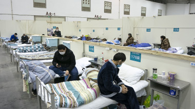 Patients are seen at a temporary hospital converted from 'Wuhan Livingroom' in central China's Hubei Province. Coronavirus Outbreak, Wuhan, China - 10 Feb 2020 In face of the outbreak of the novel coronavirus pneumonia epidemic, Wuhan authorities have transformed public venues such as exhibition centers and gymnasiums into temporary hospitals. The hospitals have a large capacity of treating patients with mild symptoms and play an important role in isolating the source of infection and cutting off the routes of infection during epidemic prevention. The first batch of patients was hospitalized on Feb. 5., Image: 497648117, License: Rights-managed, Restrictions: , Model Release: no, Credit line: CHINE NOUVELLE/SIPA / Shutterstock Editorial / Profimedia
