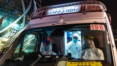 MACAU, CHINA - FEBRUARY 04: An ambulance stops for a traffic light in front of the Grand Lisboa Hotel on February 4, 2020 in Macau, China. Macau government announced to close casinos for two weeks after a hotel worker is infected. Macau has 10 confirmed cases of Novel coronavirus (2019-nCoV), with over 20,000 confirmed cases around the world, the virus has so far claimed over 400 lives.(Photo by Anthony Kwan/Getty Images)