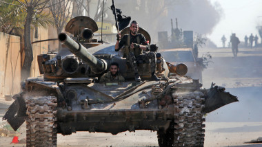 Turkey-backed Syrian fighters ride a tank in the town of Saraqib in the eastern part of the Idlib province in northwestern Syria, on February 27, 2020. Syrian rebels reentered the key northwestern crossroads town of Saraqib lost to government forces earlier this month but fierce fighting raged on in its outskirts today, an AFP correspondent reported., Image: 501422091, License: Rights-managed, Restrictions: , Model Release: no, Credit line: Bakr ALKASEM / AFP / Profimedia