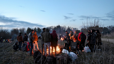Migrants stand around a fire while they are camping next the Greece border, along the Turkey-Greece border near Pazarkule, in Edirne district, on February 28 , 2020. Turkey will no longer close its border gates to refugees who want to go to Europe , a senior official told AFP on February 28, shortly after the killing of 33 Turkish soldiers in an airstrike in northern Syria., Image: 501727047, License: Rights-managed, Restrictions: , Model Release: no, Credit line: Ozan KOSE / AFP / Profimedia