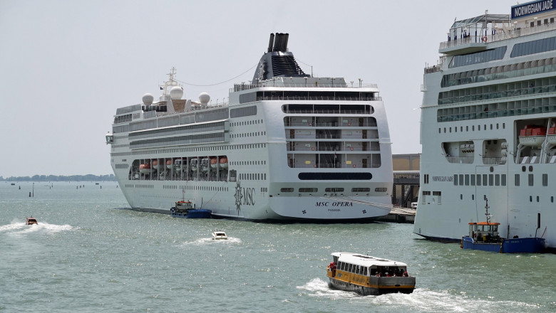 09 June 2019, Italy, Venedig: The cruise ships MSC Opera (l) and Norwegian Jade are anchored in the cruise terminal Venezia. In the foreground a launch of the Alilaguna leaves the passenger terminal. Photo: Soeren Stache/dpa-Zentralbild/ZB
