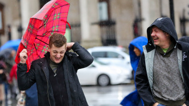 A man struggles to control his umbrella in Trafalgar Square during wet and windy weather as Storm Dennis arrives in London. Seasonal weather, London, UK - 15 Feb 2020 Heavy rain and strong winds are forecast from today until Monday 17 February as the Storm Dennis sweeps across the UK with heavy rain, gale force winds and flooding., Image: 498741575, License: Rights-managed, Restrictions: , Model Release: no, Credit line: Dinendra Haria/LNP / Shutterstock Editorial / Profimedia