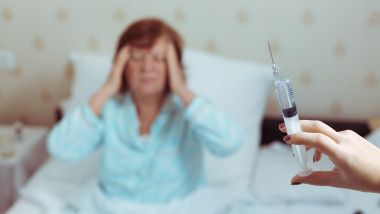 Pensioner woman in bed got syringe.