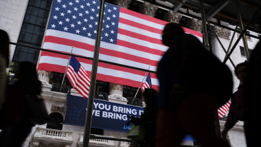 NEW YORK, NEW YORK - FEBRUARY 12: People walk past the New York Stock Exchange (NYSE) on February 12, 2020 in New York City. The market closed up over 250 points as gains in tech companies and retailers outweighed concerns over the coronavirus. (Photo by Spencer Platt/Getty Images)