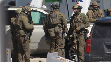 Members of the Royal Canadian Mounted Police (RCMP) tactical unit confer after the suspect in a deadly shooting rampage was neutralized at the Big Stop near Elmsdale, Nova Scotia, Canada, on April 19, 2020. A gunman killed at least 10 people in an overnight shooting rampage across rural Nova Scotia, before being found dead following an hours-long manhunt, Canadian federal police said April 19. Earlier identified as 51-year-old Gabriel Wortman, the suspect had been on the run since Saturday night, when police were alerted to shots being fired in the small community of Portapique, around 100 kilometers (60 miles) from Halifax, capital of the Atlantic province., Image: 514308487, License: Rights-managed, Restrictions: , Model Release: no, Credit line: tim krochak / AFP / Profimedia
