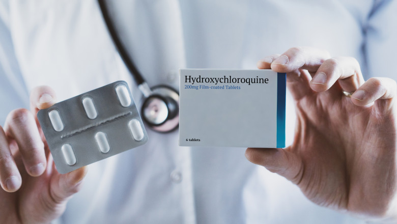 Doctor holding Hydroxychloroquine drug