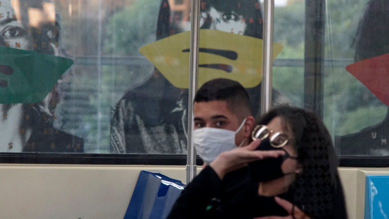 View of the Brazilian artist Alex Flemming work "Estacao Sumare" artistically tapped with face masks on top of the portrayed faces to warn about the importance of using protective face masks, to prevent the spread of the new coronavirus, COVID-19, at the Sumare subway station, in Sao Paulo, Brazil, on May 10, 2020. - Flemming's artistic installation, inaugurated in 1998, consists of 44 panels 1.75 meters high by 1.25 meters wide, and portrays all the racial diversity of the city of Sao Paulo with anonymous people who seem to observe the movement of the subway station. Coronavirus Covid-19 outbreak, Sao Paulo, Brazil - 10 May 2020, Image: 518565148, License: Rights-managed, Restrictions: , Model Release: no, Credit line: Cris Faga / Shutterstock Editorial / Profimedia