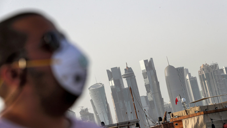 (FILES) In this file photo taken on March 16, 2020 A man wearing a mask as a precaution against COVID-19 coronavirus disease, walks along the Doha corniche in the Qatari capital. Qatar on May 17 began enforcing the world's toughest penalties of up to three-years imprisonment for failing to wear masks in public places as it battled a coronavirus infection rate among the highest globally., Image: 520010779, License: Rights-managed, Restrictions: QATAR OUT, Model Release: no, Credit line: AFP / AFP / Profimedia