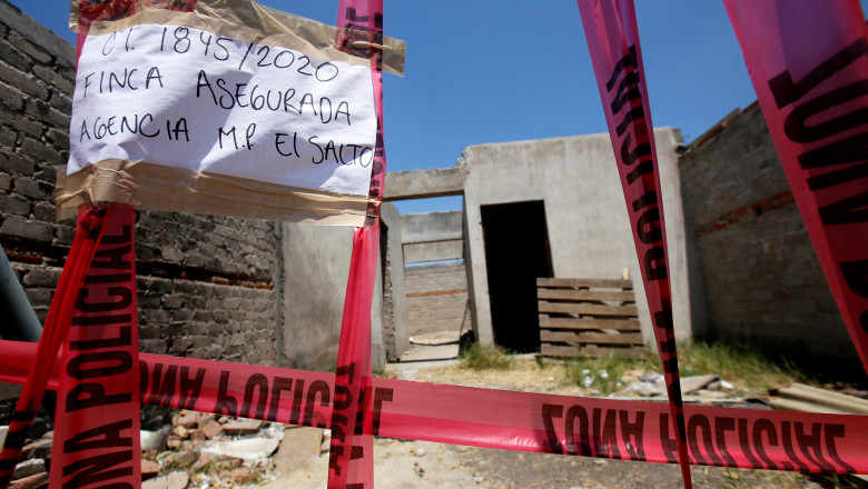 Picture of a taped-off unfinished construction at the farm where remains of at least 25 people were found buried in a clandestine mass grave in the municipality of El Salto, outside the western Mexican city of Guadalajara, in Jalisco State, taken on May 10, 2020. The mass grave was found on Thursday and searchers have so far "extracted the remains of 25 unidentified dead people, as well as five bags that are presumed to also contain human remains," the Jalisco state prosecutor's office said Sunday., Image: 518496446, License: Rights-managed, Restrictions: , Model Release: no, Credit line: Ulises RUIZ / AFP / Profimedia