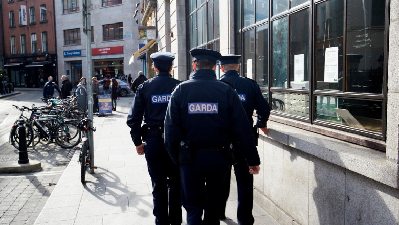 three garda officers one female two male on foot patrol in the temple bar area of Dublin Republic of Ireland europe