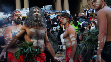 SYDNEY, AUSTRALIA - JUNE 06: Aboriginal protesters conduct a traditional smoking ceremony at Town Hall during a 'Black Lives Matter' protest march on June 06, 2020 in Sydney, Australia. Events across Australia have been organised in solidarity with protests in the United States following the killing of an unarmed black man George Floyd at the hands of a police officer in Minneapolis, Minnesota and to rally against aboriginal deaths in custody in Australia. (Photo by Lisa Maree Williams/Getty Images)
