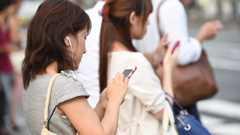 TOKYO, JAPAN - JULY 16: People use their smartphones on July 16, 2014 in Tokyo, Japan. Only 53.5% of Japanese owned smartphones in March, according to a white paper released by the Ministry of Communications on July 15, 2014. The survey of a thousand participants each from Japan, the U.S., Britain, France, South Korea and Singapore, demonstrated that Japan had the fewest rate of the six; Singapore had the highest at 93.1%, followed by South Korea at 88.7%, UK at 80%, and France at 71.6%, and U.S. at 69.6% in the U.S. On the other hand, Japan had the highest percentage of regular mobile phone owners with 28.7%. (Photo by Atsushi Tomura/Getty Images)