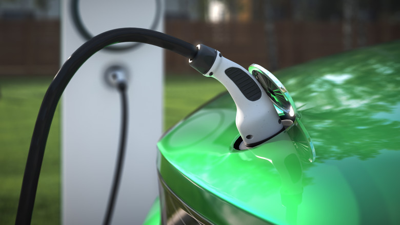 Charging your EV at home with a charging plug close up 3d rendering
