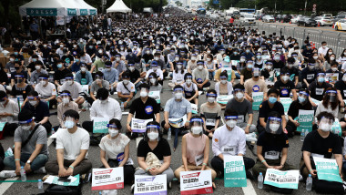 SEOUL, SOUTH KOREA - AUGUST 07: Interns and resident doctors participate in a rally against the government medical plan amid coronavirus on August 07, 2020 in Seoul, South Korea. Medical residents went on a one day strike nationwide to call for the government to scrap its plan to expand the number of students at medical schools. (Photo by Chung Sung-Jun/Getty Images)