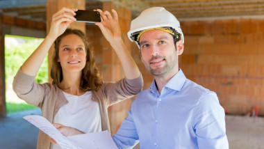 View of a Young woman and architect on construction site