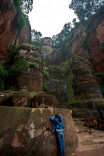 Tourists are praying to the Leshan Giant Buddha. The Leshan