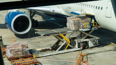 Scene of Loading luggage and cargo to airplane with handling operations in airport, Travel and Transportation concept