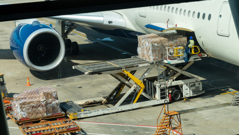 Scene of Loading luggage and cargo to airplane with handling operations in airport, Travel and Transportation concept