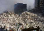 Rescue Workers Search Through WTC Rubble