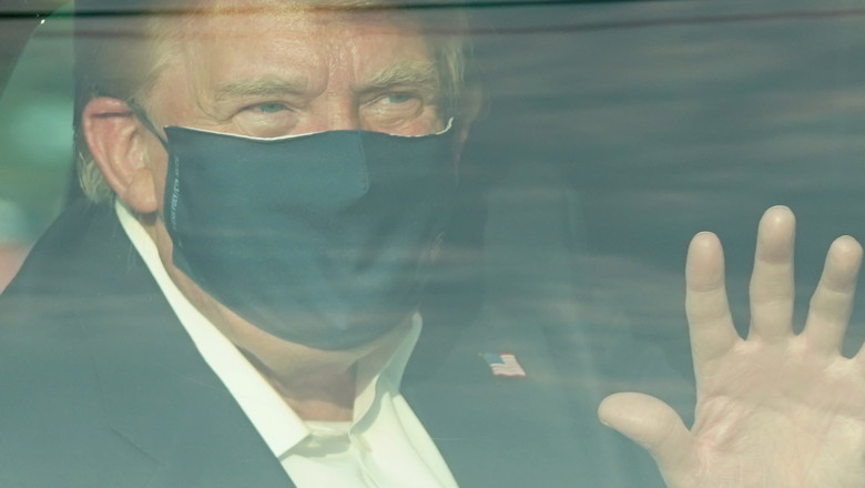 Trump, in masina blindata, poarta masca neagra si face cu mana