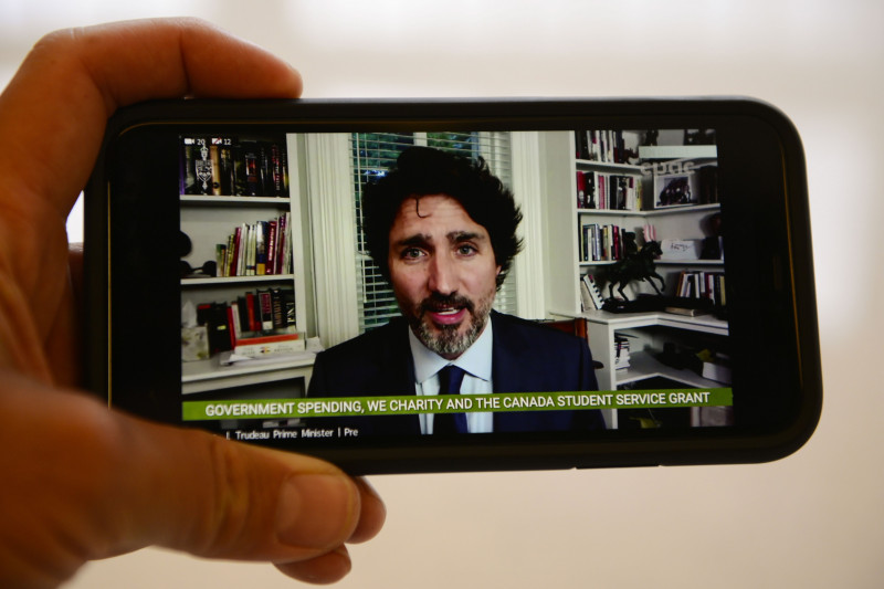 Canadian Prime Minister Justin Trudeau speaks on the phone via videoconference