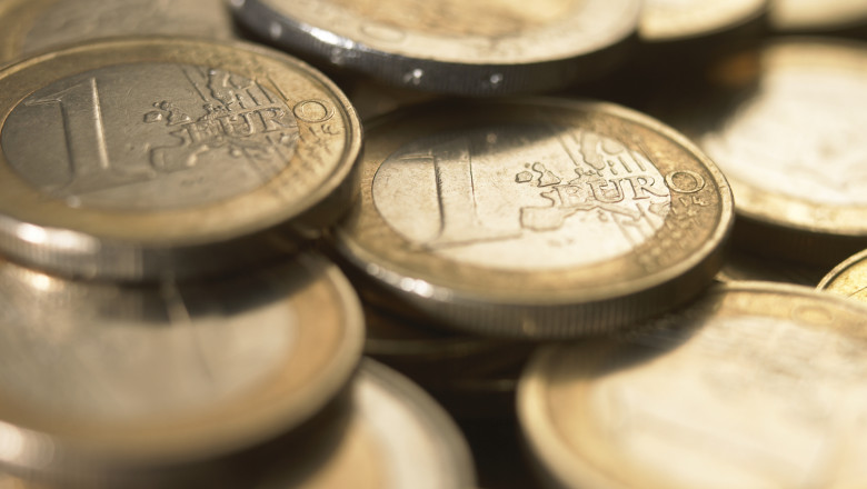 Euro Currency: Pile of 1 euro coins, close-up