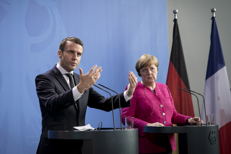 French President Emmanuel Macron Meets Angela Merkel In Berlin