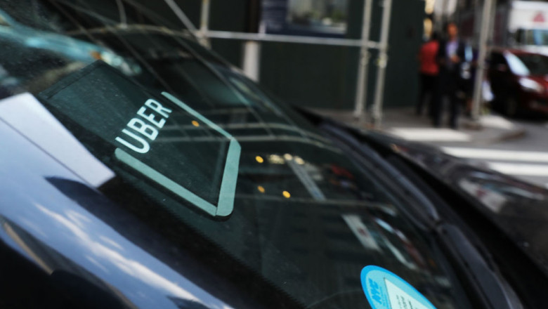NEW YORK, NY - JUNE 14: An Uber car waits for a client in Manhattan a day after it was announced that Uber co-founder Travis Kalanick will take a leave of absence as chief executive on June 14, 2017 in New York City. The move came after former attorney general Eric H. Holder Jr. and his law firm, Covington &amp; Burling, released 13 pages of recommendations compiled as part of an investigation of sexual harassment at the ride-hailing car service. (Photo by Spencer Platt/Getty Images)