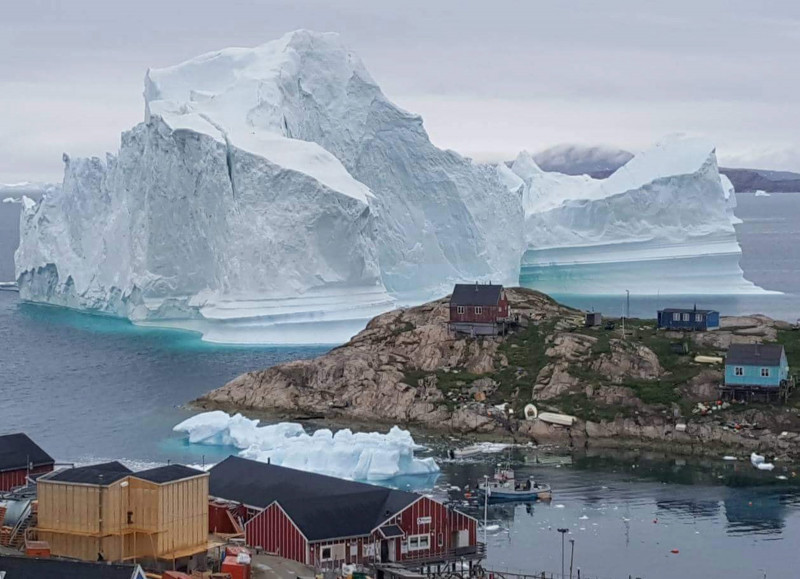 Iceberg grounded outside village in northwestern Greenland
