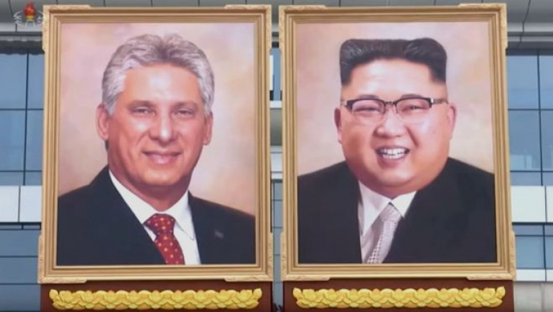 Portretele lui Kim Jong-un, liderul Coreei de Nord, și al președintelui cubanez Miguel Diaz-Cane