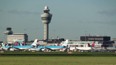Amsterdam Schiphol International Airport And Passenger Airplane View In The Netherlands. Europe
