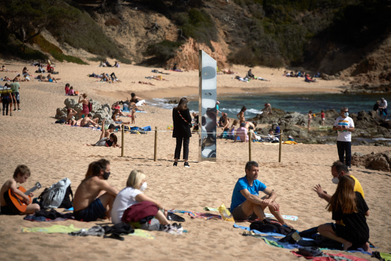 A metallic monolith appears on a beach in Catalonia