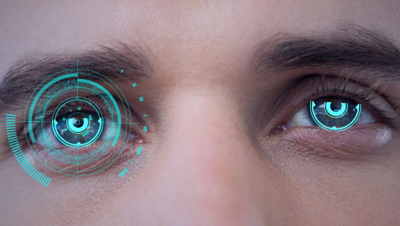 Digital composite image of round scanner against close up of male human eyes