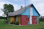 The facade of the House painted Kihnu skirt colors. Kihnu Island, Estonia 5th August 2017