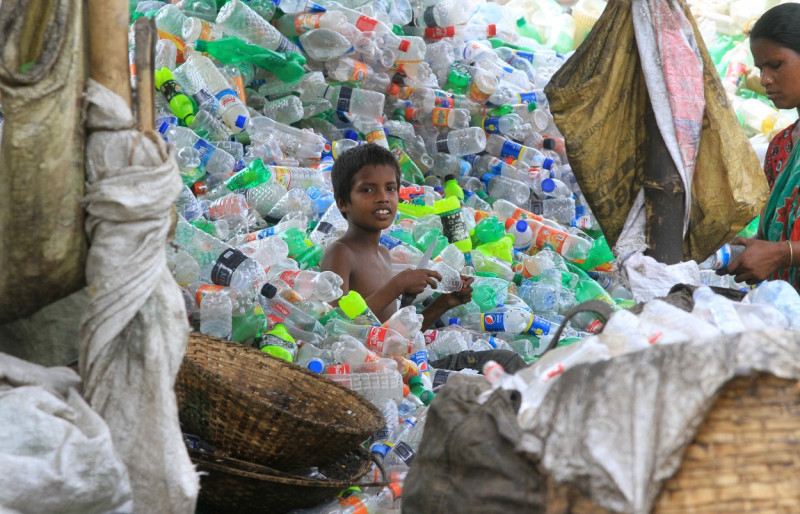 Bangladesh: Plastic bottle recycling factory besides the river Buriganga in Dhaka