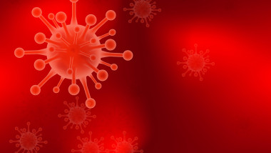 Virusul SARS-CoV-2 pe un fundal rosu