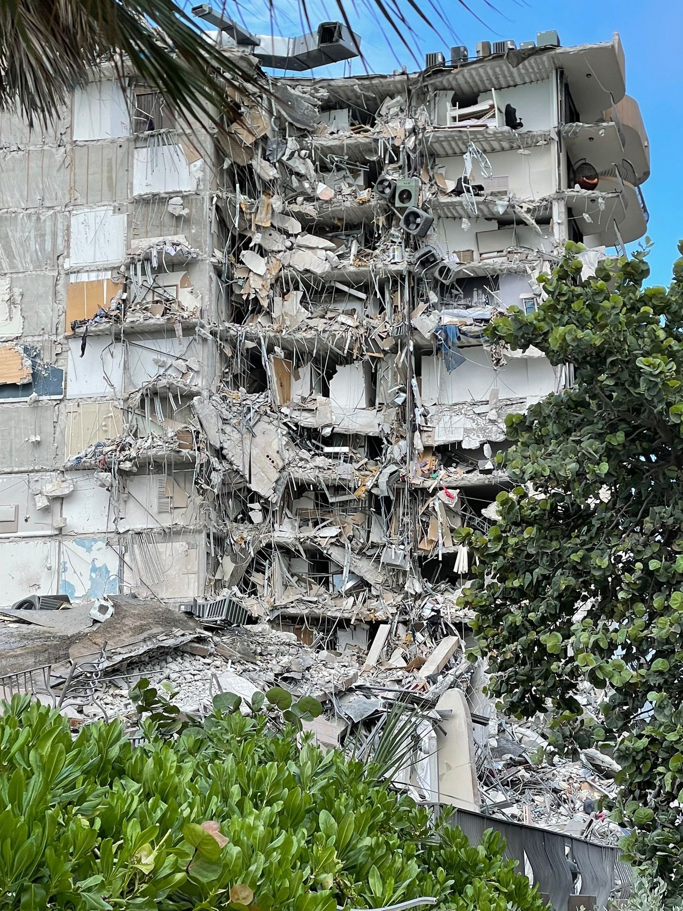 Oceanfront Miami Beach condo tower collapses leaving at least one dead.