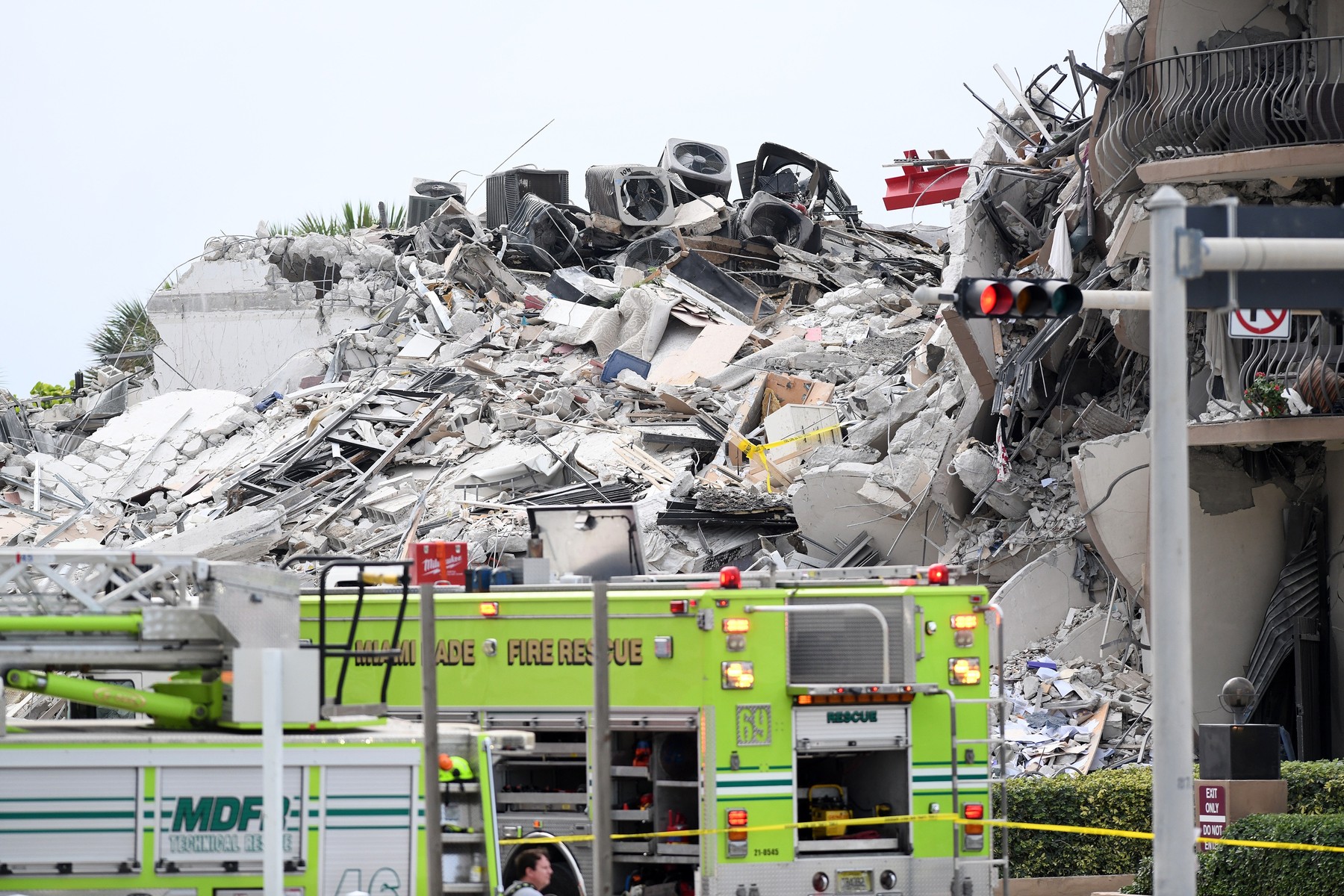 Massive rubble pile is seen at location of residential condo collapse in upscale Miami Beach neighborhood
