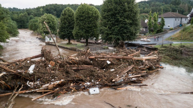 a bridge damaged by trunks and debris following heavy rains and flood in Echtershausen