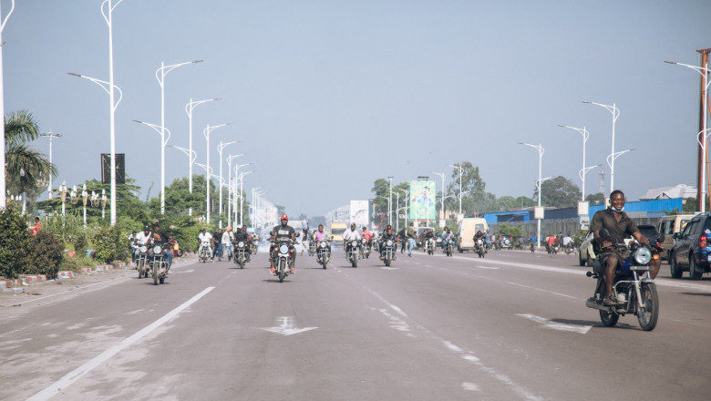 Bikers demonstrate outside the Congolese Parliament in Kinshasa