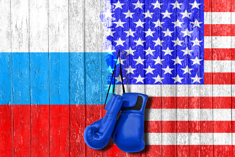Flag of Russia and USA painted on the wooden board. Arms race and rivalry. The third world war. The conflict between Russia and America.