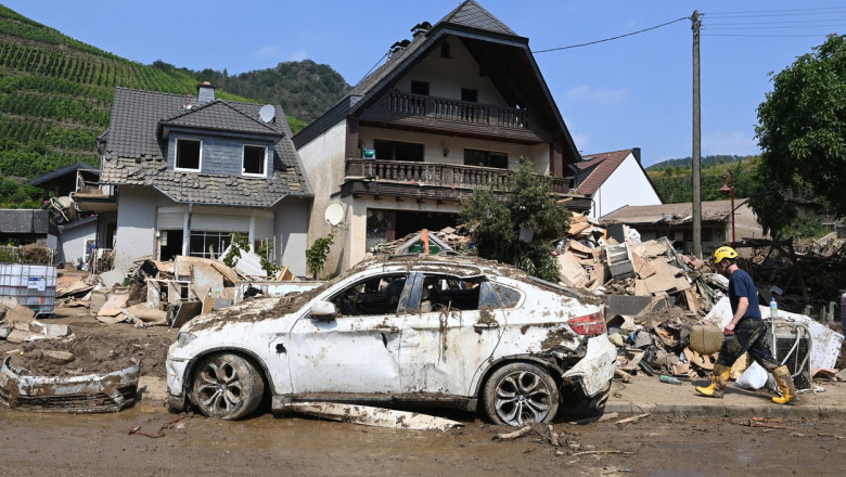 A destroyed car is seen in Mayschoss in the district of Ahrweiler, western Germany, on July 23, 2021, days after heavy rain and floods caused major damage in the Ahr region. In mid-July western Europe was hit by devastating floods after torrential rains