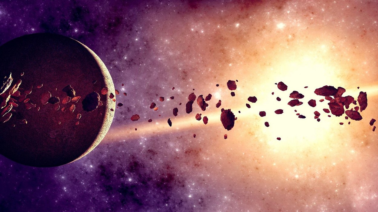 Doua roci roşiatice uriaşe, cu materie organica complexa, identificate de oamenii de ştiinţa in centura de asteroizi