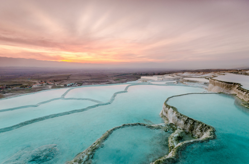 Carbonate travertines the natural pools during sunset, Pamukkale