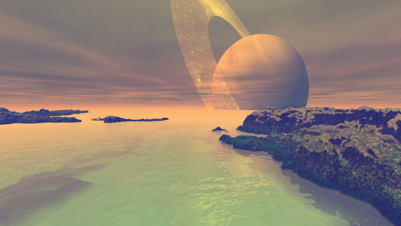 Ilustrație a suprafeței de pe Titan cu planeta Saturn vizibilă pe cerul planetei