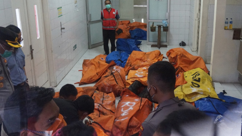 Police and hospital officials store body bags of dead victims at a morgue in a local general hospital in Tangerang on September 8, 2021, after a prison fire broke out and killed 41 inmates