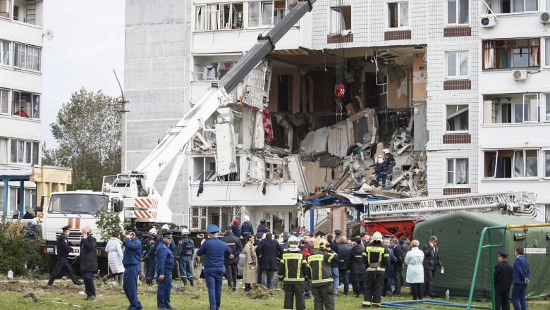 Rescue service workers at the scene of a fatal domestic gas blast at a nine-storey block of flats in the town of Noginsk, 40 km east of Moscow