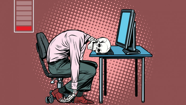 grafica cu un barbat ajuns schelet care sta cu capul pe tastatura